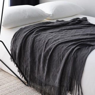 Cobertor elegante com franjas texturizadas